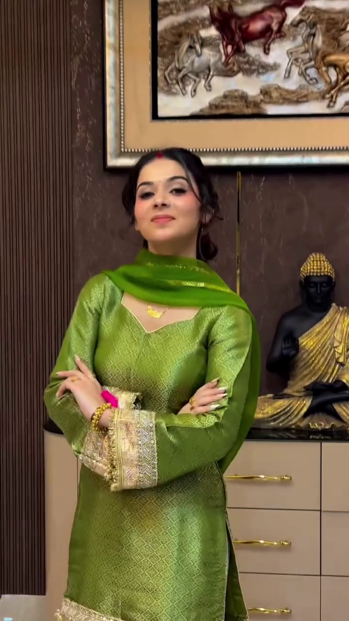 Radiant Grace in a Rich Green Ethnic Ensemble