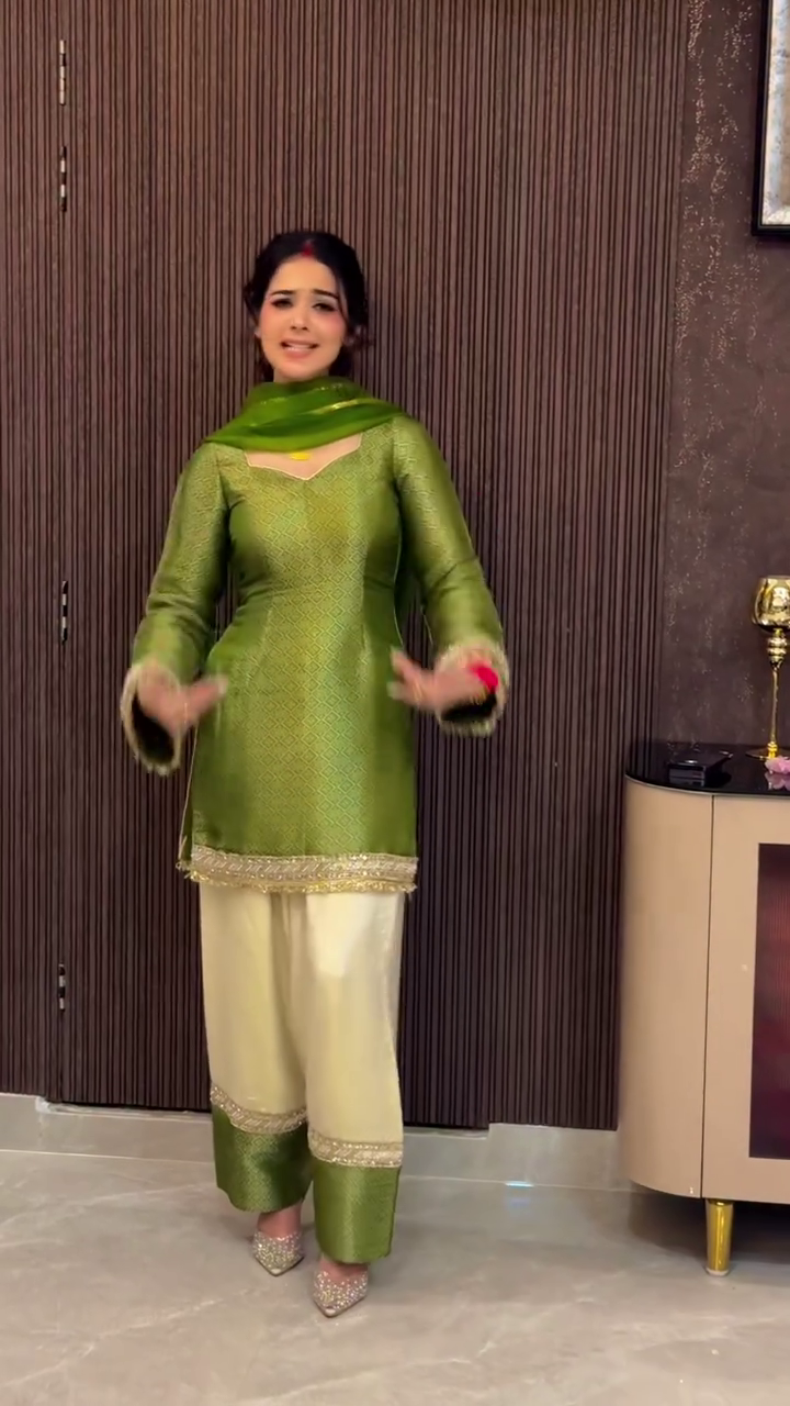 Radiant Grace in a Rich Green Ethnic Ensemble